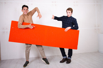 Two attractive students posing in the studio.