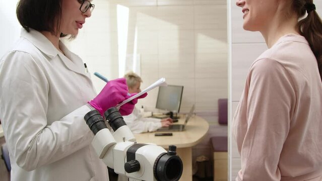 A female patient has a consultation with her gynecologist in a medical clinic. Women's health, colposcopy, examination of the uterus and ovaries.