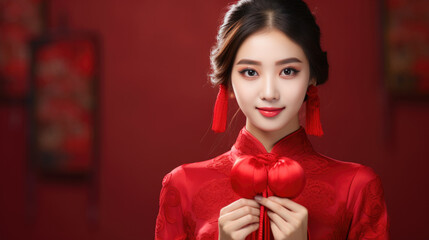 Chinese beautiful smiling girl with Chinese traditional clothing on Chinese new year background