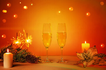 New Year greeting card with champagne and decoration on the table.