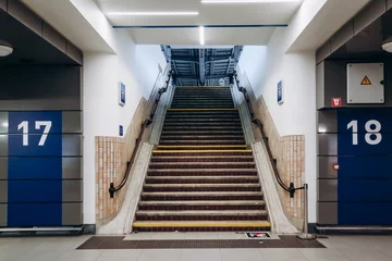 Zelfklevend Fotobehang Stairs leading to the station platform in Brussels (Brussels-Midi railway station) © Andrei Antipov
