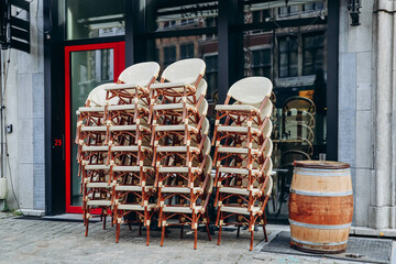 Antwerp, Belgium - October 22, 2023: Chairs arranged in front of a restaurant in the center of Antwerp