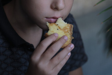 child savors a bite of sesame toast, a moment of simple pleasure. Such images highlight the shift...