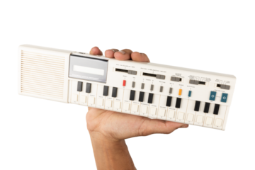 Male hand holding a 90s synth and calculator isolated no background