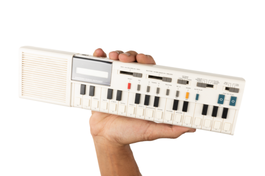 Male hand holding a 90s synth and calculator isolated no background