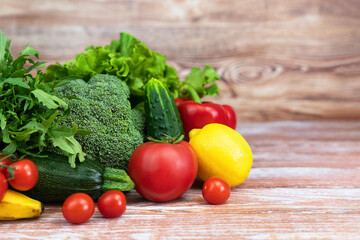 Vegetables and fruits on a wooden table. Thanksgiving Day. Healthy food, harvesting. Copy space.