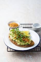 Healthy avocado toast with onion crunch