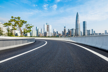 Fototapeta na wymiar Asphalt highway and city skyline scenery in Shenzhen, Guangdong Province, China. Road and city buildings background.