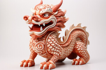 Fototapeta premium Ceramic dragon statuette symbolising prosperity in Lunar New Year isolated on a white background 