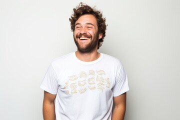 Portrait of a jovial man in his 30s sporting a vintage band t-shirt against a white background. AI Generation