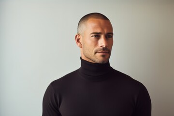 Fototapeta premium Portrait of a tender man in his 30s wearing a classic turtleneck sweater against a modern minimalist interior. AI Generation