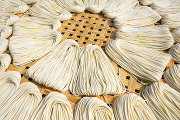 Close-up of traditional handmade noodle-making drying outdoors in Guanmiao, Tainan, Taiwan.