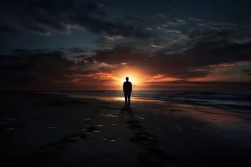 Foto op Plexiglas Sad man silhouette worried on the beach © alisaaa