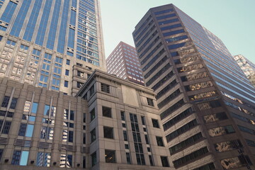 Fototapeta na wymiar Center City Masonry, Glass, Steel Skyscapers against Blue Sky Background