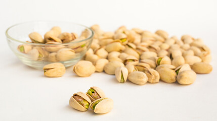 Roasted pistachios on white background