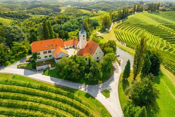 Aerial view of the Church and green vineyards, Jeruzalem winery region, Slovenia - 678173586