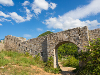 Fototapeta na wymiar Ruins of medieval fortress Tvrdava Mogren at the shore of Adriatic sea, Montenegro.