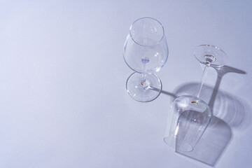 Two empty wine glass on gray background top view