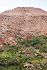 Fototapeta na wymiar Orange mud villages on the valley of a river in the Atlas Mountains in North Africa