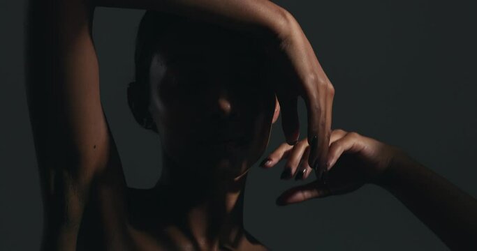 Beauty, sensual and face of woman in a studio with body care, wellness and health routine. Cosmetic, movement and portrait of an Indian female model with glowing skin treatment by a black background.