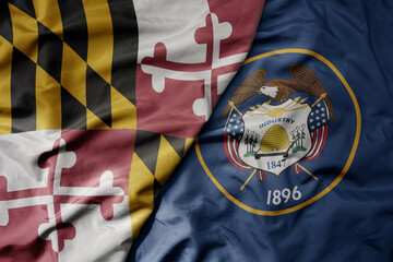 Fototapeta premium big waving colorful national flag of utah state and flag of maryland state .