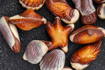 seashells candy chocolate sweet dessert eating meal food snack on the table copy space food background rustic top view
