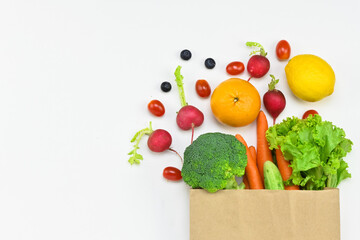 Healthy food background, healthy vegetarian food in paper bags, fruits and vegetables, banner copy space, supermarket shopping, food and clean vegetarian diet concept, organic fruits and vegetables co