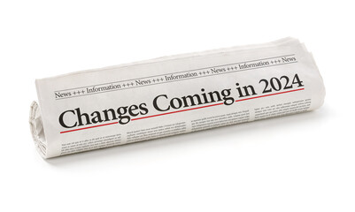 Rolled newspaper with the headline Changes coming in 2024 - obrazy, fototapety, plakaty
