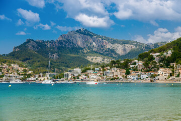 Azure sea with mountains on a background in the small coastal town Port de Soller