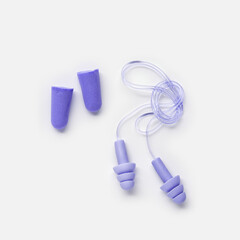 Different earplugs on white background, comfort silicone and rubber ear plug on string protection against noise, protect hear, for swim, sleep, comfort rest. Top view flat lay photo, design