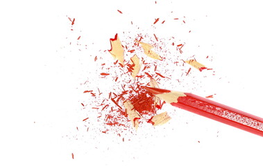 Red pencil tip shavings from sharpener isolated on white background and texture, top view
