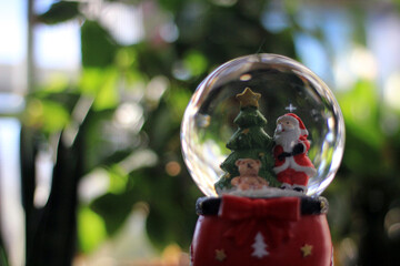 Snow Globe with Santa Claus. Christmas or New Year gift, Close up view, selective focus