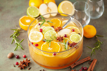 Homemade hot alcohol apple cider punch with cinnamon sticks, anise star and spices