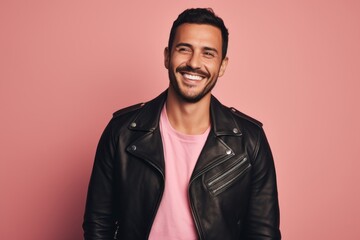 Fototapeta premium Portrait of a satisfied man in his 30s sporting a classic leather jacket against a pastel or soft colors background. AI Generation