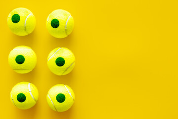 Fototapeta premium Set of green tennis balls, top view. Sport games background