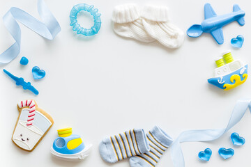 Frame of bluy baby boy accessories with toys and gift box, top view