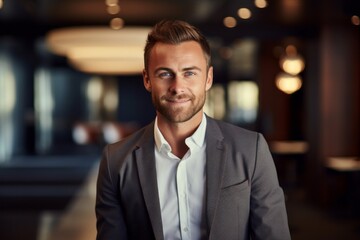 Portrait of a grinning man in his 30s dressed in a stylish blazer against a scandinavian-style interior background. AI Generation