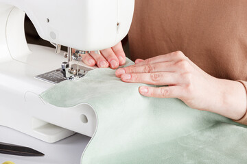 Sewing machine, stitching fabrics, needle in a round plan