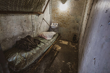 Interior of a prison cell. - obrazy, fototapety, plakaty