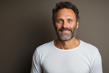 Portrait of a joyful man in his 40s sporting a long-sleeved thermal undershirt against a light wood minimalistic setup. AI Generation - obrazy, fototapety, plakaty
