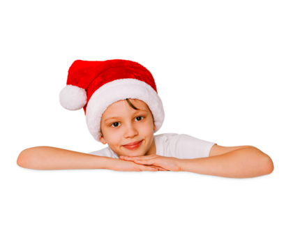 Beautiful christmas boy in a red santa hat isolated