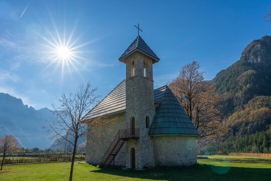albania theth national park and stone church among mountains blue sky over valley