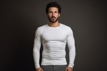Portrait of a content man in his 30s showing off a lightweight base layer against a plain cyclorama studio wall. AI Generation