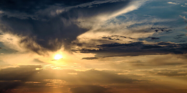 a sunset with dramatic clouds and rays of sunlight.