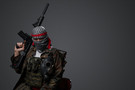 Militant from the Middle East, dressed in a white keffiyeh and camouflaged field attire, wielding an automatic rifle, set against a neutral gray backdrop