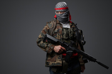 Militant from the Middle East, dressed in a white keffiyeh and camouflaged field attire, wielding an automatic rifle, set against a neutral gray backdrop