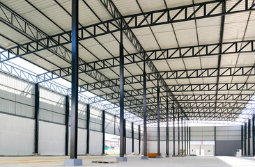 Corrugated steel roof with metal roof beam and columns of new warehouse building structure is under...