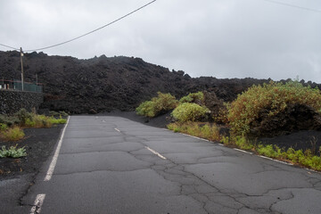 Road closed due to the passage of a lava flow in the last eruption of La Palma volcano - 678240986