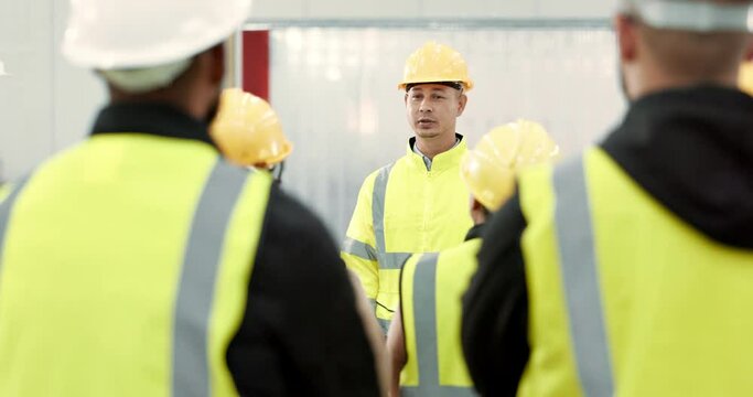 Factory, workers and group with manager in meeting with tablet for safety inspection and industrial rules for workplace. Manufacturing, team and supervisor speaking or training warehouse staff