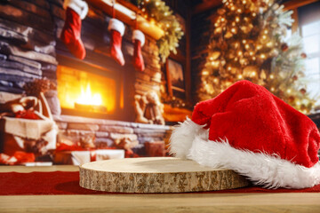 Obraz na płótnie Canvas Desk of free space and santa claus hat. Home interior with fireplace and empty space for your decoration. 